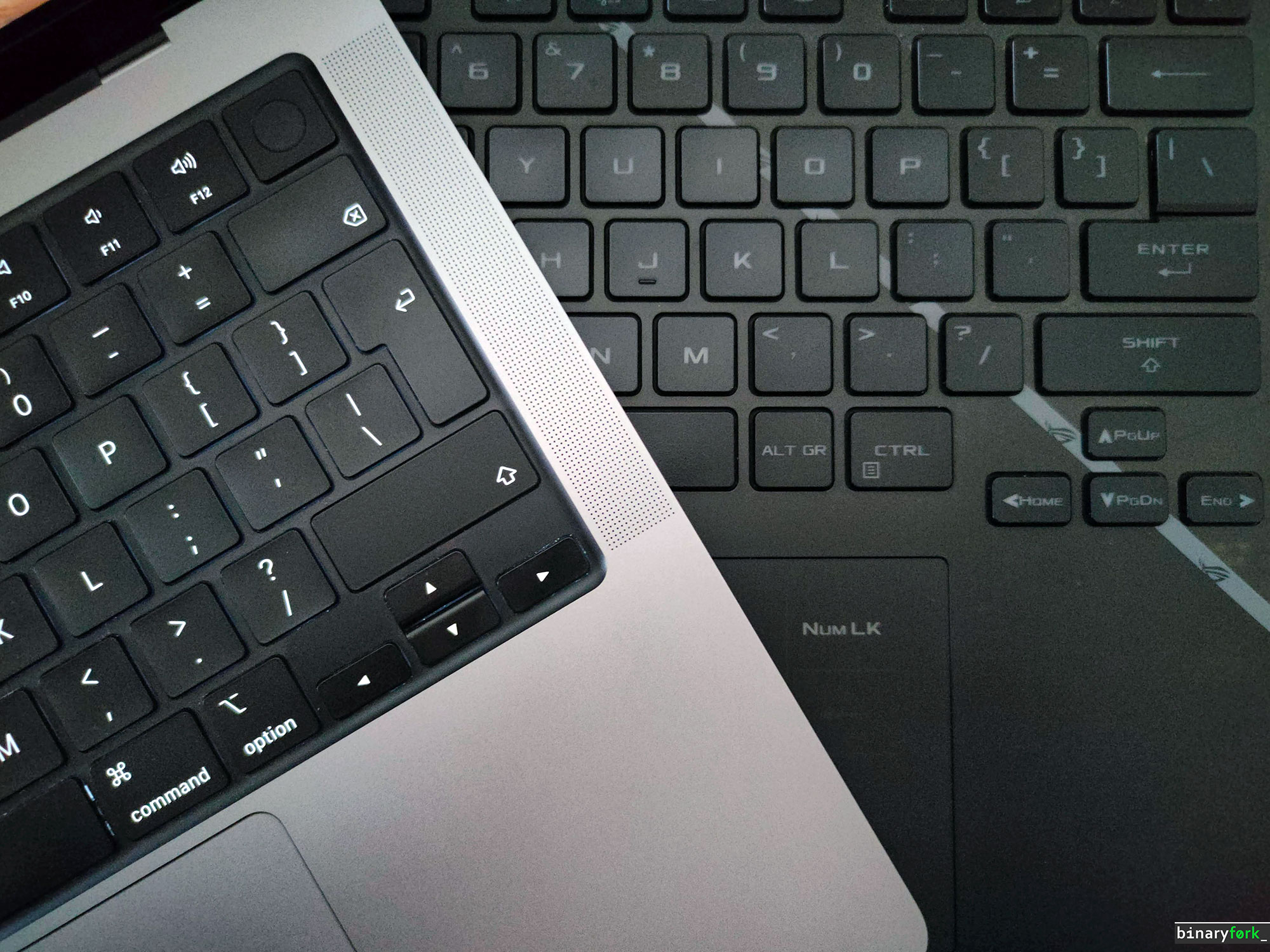 macbook vs rog windows laptop keyboard design